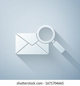 Paper cut Envelope mail with magnifying glass icon isolated on grey background. Paper art style. Vector Illustration