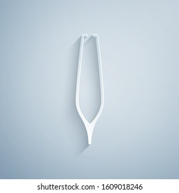 Paper cut Eyebrow tweezers icon isolated on grey background. Cosmetic tweezers for ingrown hair. Paper art style. Vector Illustration