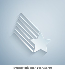 Paper cut Falling star icon isolated on grey background. Shooting star with star trail. Meteoroid, meteorite, comet, asteroid, star icon. Paper art style. Vector Illustration