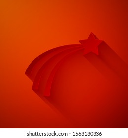 Paper cut Falling star icon isolated on red background. Shooting star with star trail. Meteoroid, meteorite, comet, asteroid, star icon. Paper art style. Vector Illustration