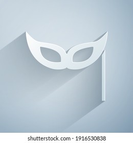 Paper cut Festive mask icon isolated on grey background. Merry Christmas and Happy New Year. Paper art style. Vector