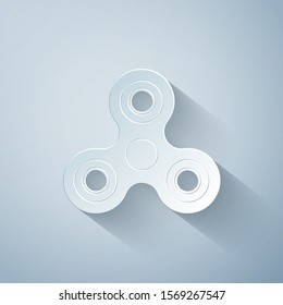 Paper cut Fidget spinner icon isolated on grey background. Stress relieving toy. Trendy hand spinner. Paper art style. Vector Illustration