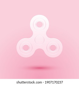 Recorte de papel Icono del tirador del fidget aislado en fondo rosado. El estrés aliviando el juguete. Trendy. Estilo de arte de papel. Vector.