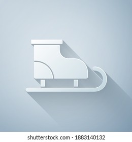 Paper cut Figure skates icon isolated on grey background. Ice skate shoes icon. Sport boots with blades. Paper art style. Vector