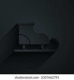 Paper cut Figure skates icon isolated on black background. Ice skate shoes icon. Sport boots with blades. Paper art style. Vector