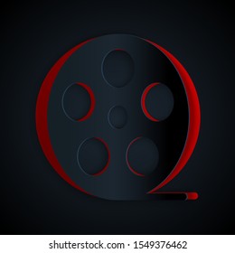 Paper cut Film reel icon isolated on black background. Paper art style. Vector Illustration