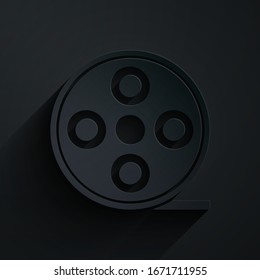 Paper cut Film reel icon isolated on black background. Paper art style. Vector Illustration