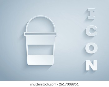 Paper cut Fire bucket icon isolated on grey background. Metal bucket empty or with water for fire fighting. Paper art style. Vector