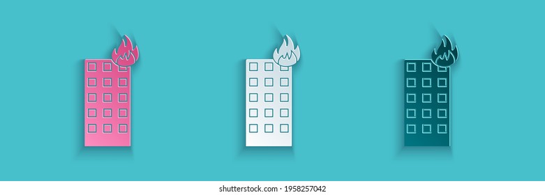 Paper cut Fire in burning building on city street icon isolated on blue background. Paper art style. Vector Illustration