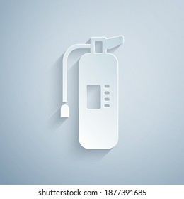 Paper cut Fire extinguisher icon isolated on grey background. Paper art style. Vector.