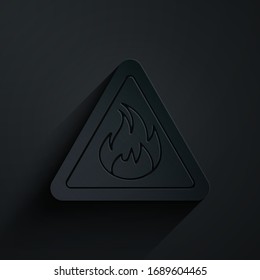 Paper cut Fire flame in triangle icon isolated on black background. Warning sign of flammable product. Paper art style. Vector Illustration