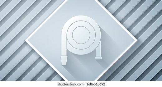 Paper cut Fire hose reel icon isolated on grey background. Paper art style. Vector Illustration