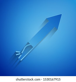 Paper cut Firework rocket icon isolated on blue background. Concept of fun party. Explosive pyrotechnic symbol. Paper art style. Vector Illustration