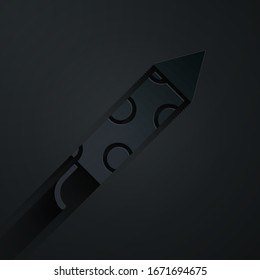 Paper cut Firework rocket icon isolated on black background. Concept of fun party. Explosive pyrotechnic symbol. Paper art style. Vector Illustration
