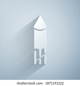 Paper cut Firework rocket icon isolated on grey background. Concept of fun party. Explosive pyrotechnic symbol. Paper art style. Vector