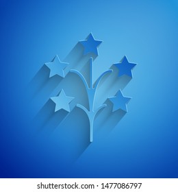 Paper cut Fireworks icon isolated on blue background. Concept of fun party. Explosive pyrotechnic symbol. Paper art style. Vector Illustration