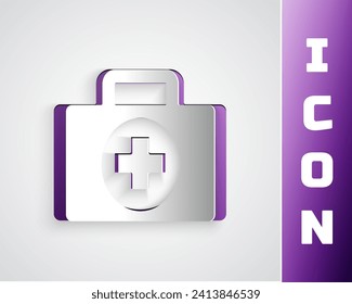 Paper cut First aid kit icon isolated on grey background. Medical box with cross. Medical equipment for emergency. Healthcare concept. Paper art style. Vector