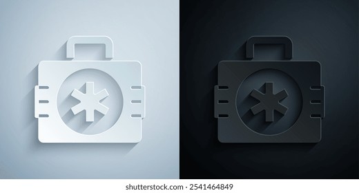 Paper cut First aid kit icon isolated on grey and black background. Medical box with cross. Medical equipment for emergency. Healthcare concept. Paper art style. Vector