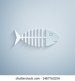 Paper cut Fish skeleton icon isolated on grey background. Fish bone sign. Paper art style. Vector Illustration