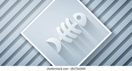 Paper cut Fish skeleton icon isolated on grey background. Fish bone sign. Paper art style. Vector