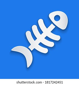 Paper cut Fish skeleton icon isolated on blue background. Fish bone sign. Paper art style. Vector