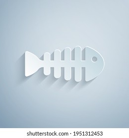 Paper cut Fish skeleton icon isolated on grey background. Fish bone sign. Paper art style. Vector