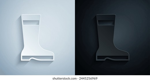 Paper cut Fishing boots icon isolated on grey and black background. Waterproof rubber boot. Gumboots for rainy weather, fishing, hunter, gardening. Paper art style. Vector