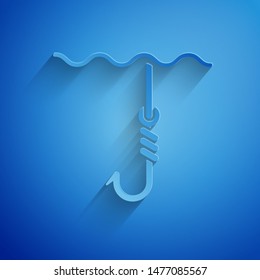 Paper cut Fishing hook under water icon isolated on blue background. Fishing tackle. Paper art style. Vector Illustration