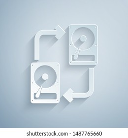 Paper cut A fixed data storage device hard disk with arrows, data copy icon isolated on grey background. Data exchange with hard disk drive. Paper art style. Vector Illustration