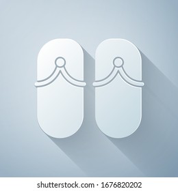 Paper cut Flip flops icon isolated on grey background. Beach slippers sign. Paper art style. Vector Illustration