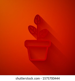 Paper cut Flowers in pot icon isolated on red background. Plant growing in a pot. Potted plant sign. Paper art style. Vector Illustration