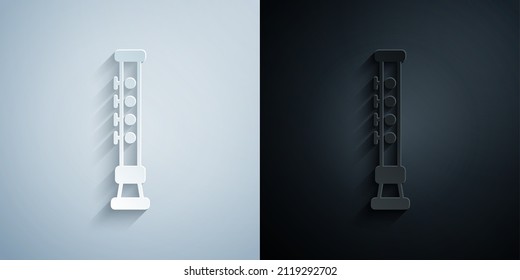 Paper cut Flute icon isolated on grey and black background. Musical instrument. Paper art style. Vector