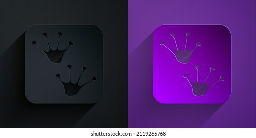 Paper cut Frog paw footprint icon isolated on black on purple background. Paper art style. Vector