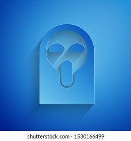 Paper cut Funny and scary ghost mask for Halloween icon isolated on blue background. Happy Halloween party. Paper art style. Vector Illustration