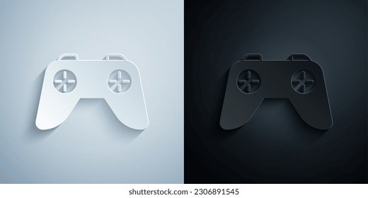 Paper cut Game controller or joystick for game console icon isolated on grey and black background. Paper art style. Vector