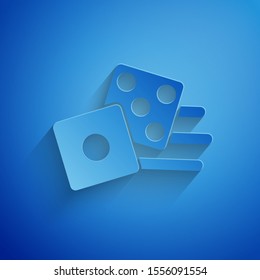 Paper cut Game dice icon isolated on blue background. Casino gambling. Paper art style. Vector Illustration