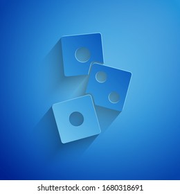 Paper cut Game dice icon isolated on blue background. Casino gambling. Paper art style. Vector Illustration