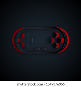 Paper cut Gamepad icon isolated on black background. Game controller. Paper art style. Vector Illustration
