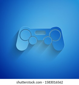 Paper cut Gamepad icon isolated on blue background. Game controller. Paper art style. Vector Illustration