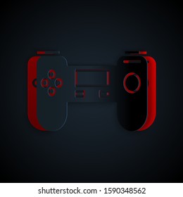 Paper cut Gamepad icon isolated on black background. Game controller. Paper art style. Vector Illustration