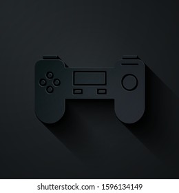 Paper cut Gamepad icon isolated on black background. Game controller. Paper art style. Vector Illustration