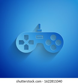 Paper cut Gamepad icon isolated on blue background. Game controller. Paper art style. Vector Illustration