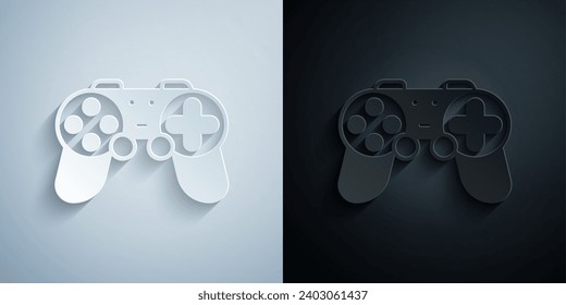 Paper cut Gamepad icon isolated on grey and black background. Game controller. Paper art style. Vector