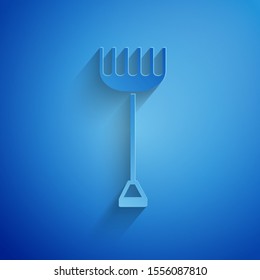 Paper cut Garden rake icon isolated on blue background. Tool for horticulture, agriculture, farming. Ground cultivator. Housekeeping equipment. Paper art style. Vector Illustration