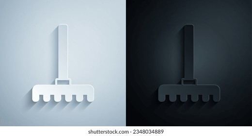 Paper cut Garden rake icon isolated on grey and black background. Tool for horticulture, agriculture, farming. Ground cultivator. Housekeeping equipment. Paper art style. Vector