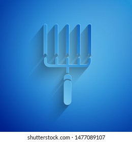 Paper cut Garden rake in work icon isolated on blue background. Tool for horticulture, agriculture, farming. Ground cultivator. Paper art style. Vector Illustration