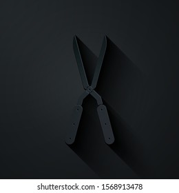 Paper cut Gardening handmade scissors for trimming icon isolated on black background. Pruning shears with wooden handles. Paper art style. Vector Illustration