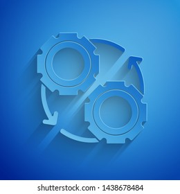 Paper cut Gear and arrows as workflow process concept icon isolated on blue background. Gear reload sign. Paper art style. Vector Illustration
