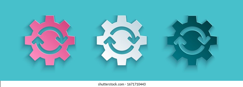 Paper cut Gear and arrows as workflow concept icon isolated on blue background. Gear reload sign. Paper art style. Vector Illustration