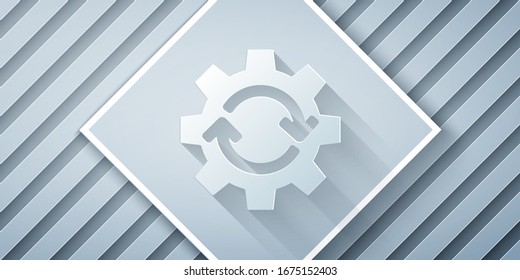 Paper cut Gear and arrows as workflow concept icon isolated on grey background. Gear reload sign. Paper art style. Vector Illustration